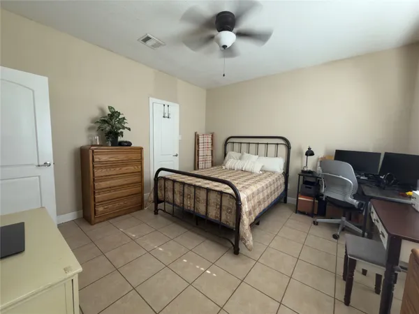 a bedroom with a bed and furniture