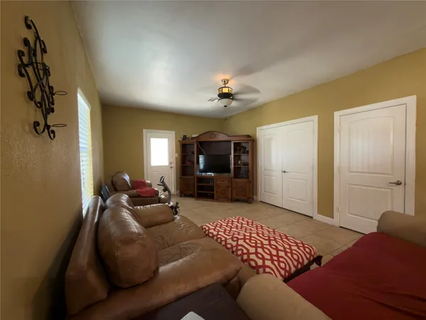 a living room with furniture and a window