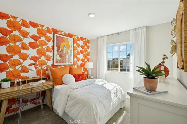 a bedroom with a bed and window