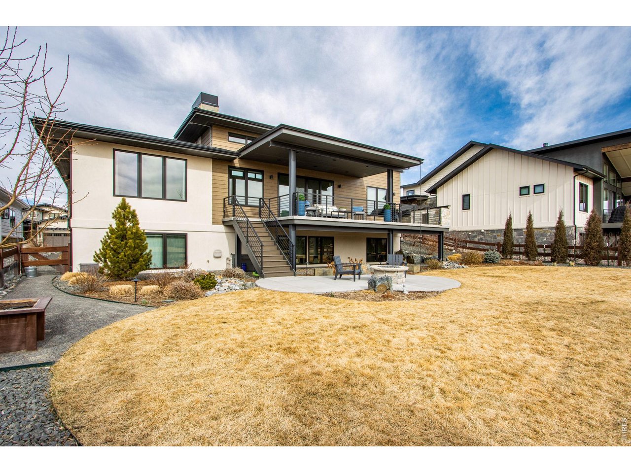 4186 Prestwich Court Timnath, CO 80547 - Photo 15 of 48 a view of house with outdoor space and swimming pool