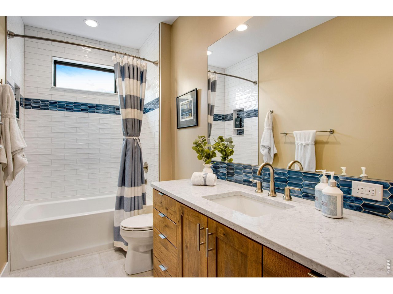 4186 Prestwich Court Timnath, CO 80547 - Photo 40 of 48 a bathroom with a sink a toilet and shower