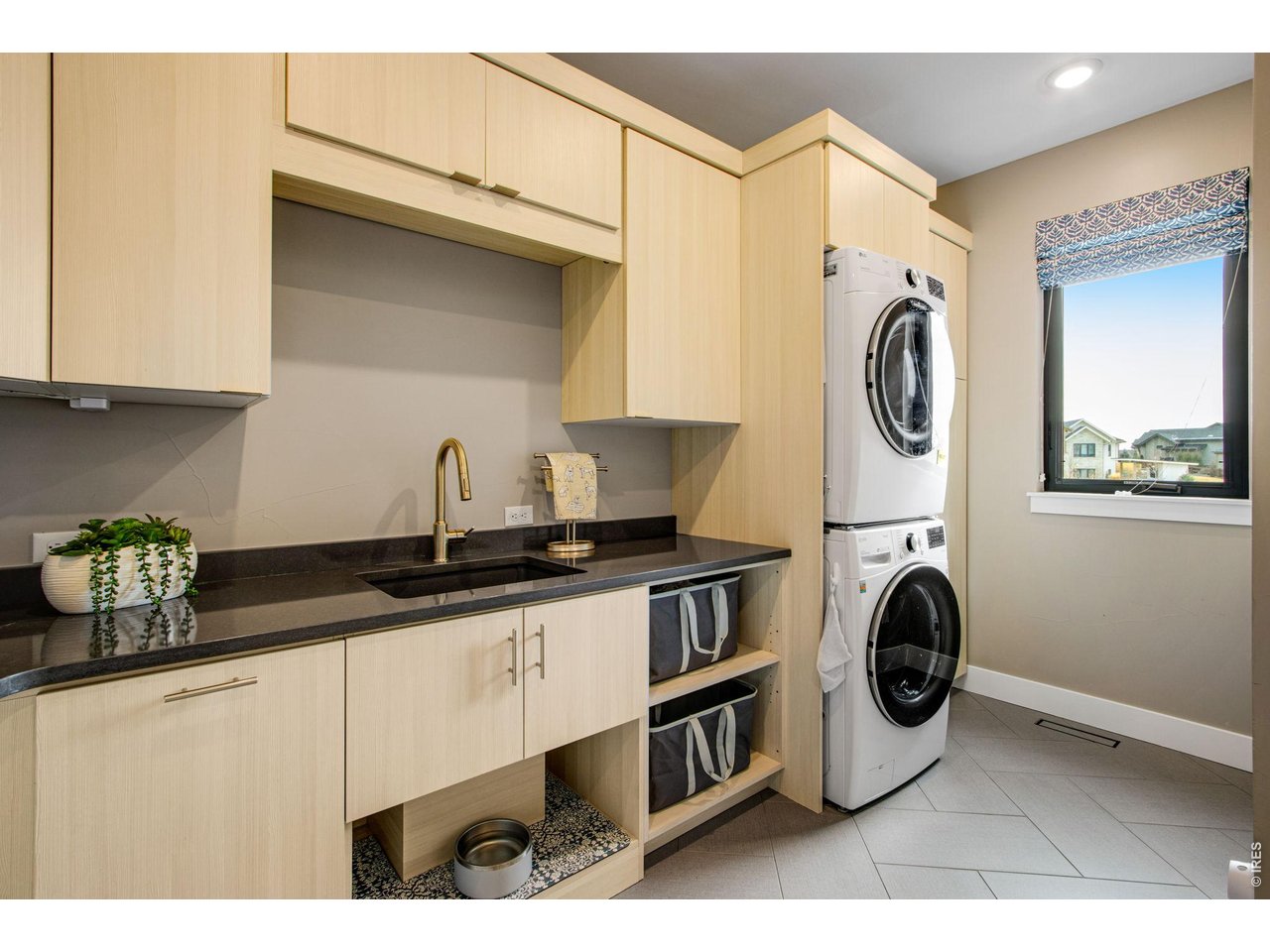 4186 Prestwich Court Timnath, CO 80547 - Photo 41 of 48 a kitchen with a stove and a sink