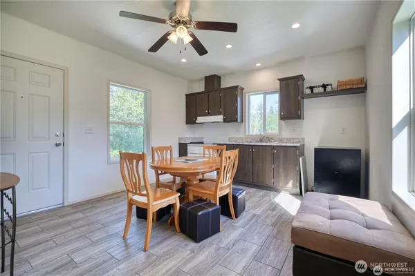 a dining room with furniture and window