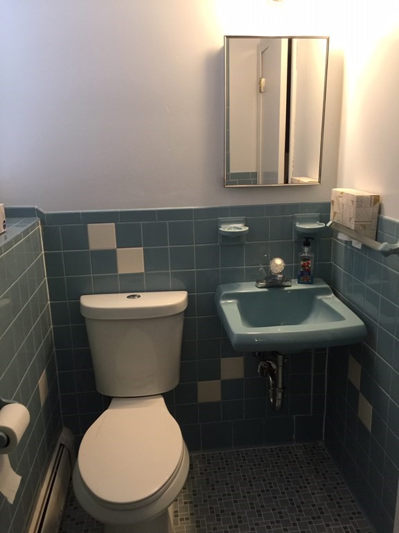 40 Niles Road Randolph, MA 02368 - Photo 14 of 29 a bathroom with a toilet a sink and a mirror