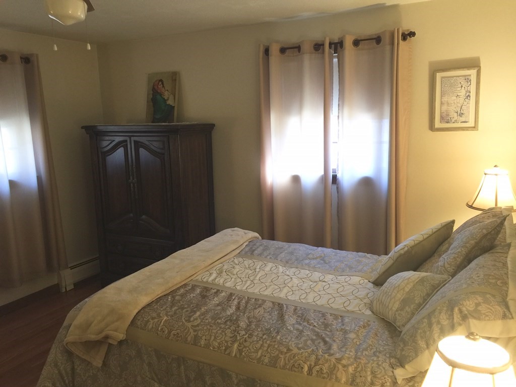 40 Niles Road Randolph, MA 02368 - Photo 17 of 29 a bedroom with a bed and a mirror