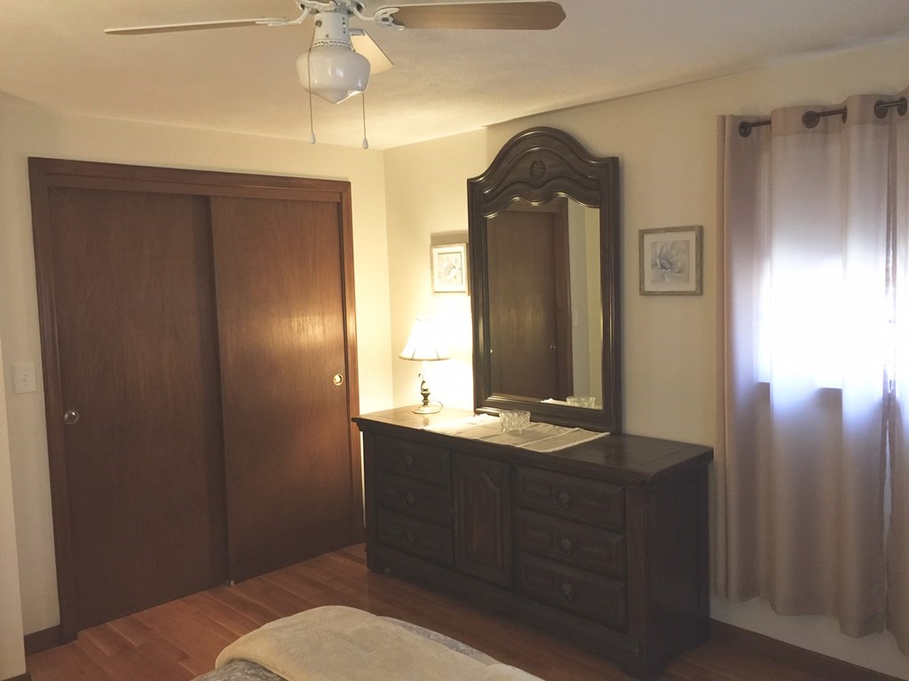 40 Niles Road Randolph, MA 02368 - Photo 18 of 29 a bathroom with a sink a mirror and a shower