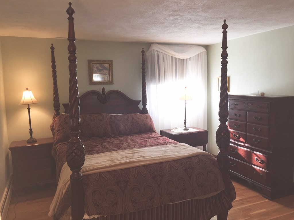 40 Niles Road Randolph, MA 02368 - Photo 21 of 29 a bedroom with a bed and window with lamp