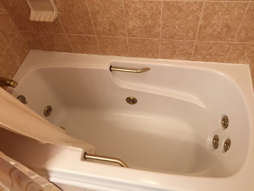 40 Niles Road Randolph, MA 02368 - Photo 24 of 29 a bathroom with a bathtub