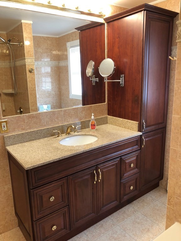 40 Niles Road Randolph, MA 02368 - Photo 25 of 29 a bathroom with a granite countertop sink and a mirror