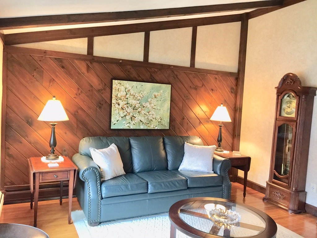 40 Niles Road Randolph, MA 02368 - Photo 5 of 29 a living room with furniture and a lamp