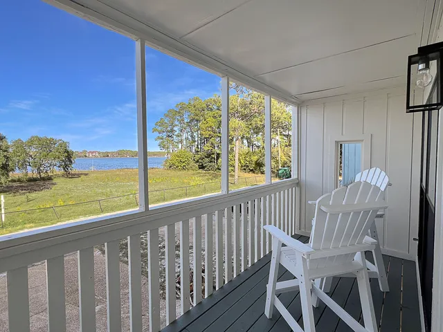 a view of a chair and table in the balcony