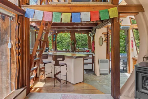 a view of kitchen with a sink and wooden floor