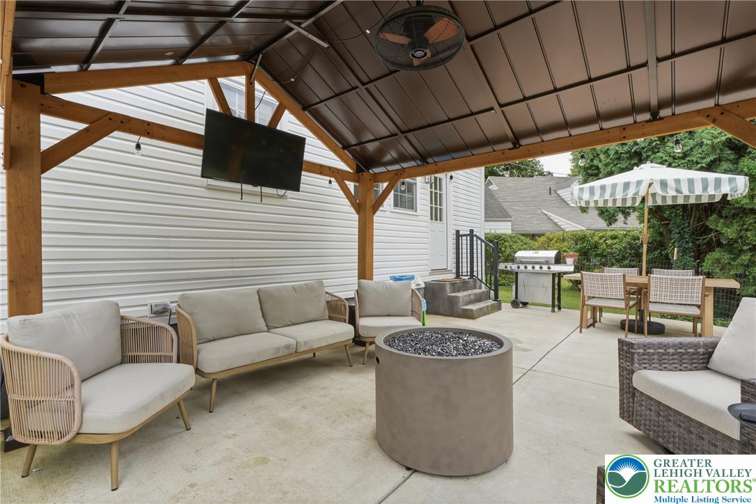 408 Maple Road Hellertown, PA 18055 - Photo 48 of 66 A sheltered pavilion provides the perfect setting for year-round outdoor entertainment.