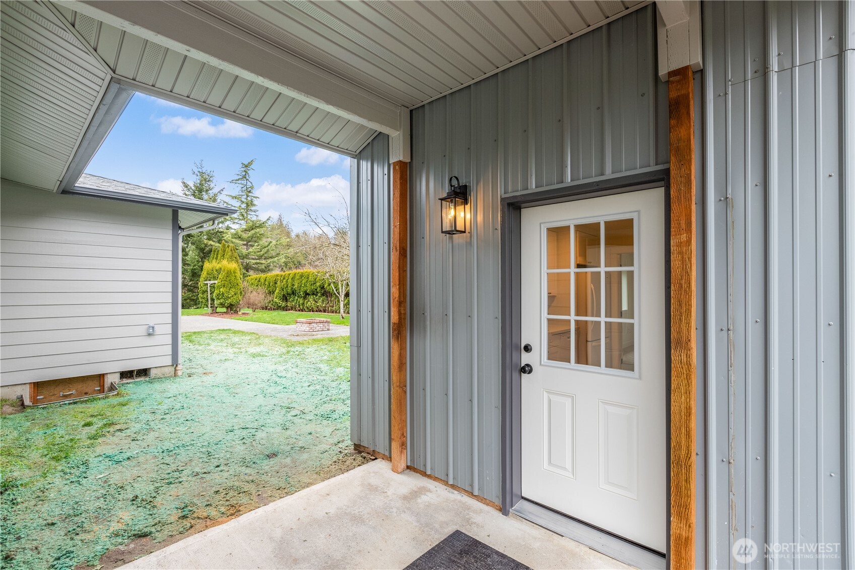 693 Shultz Drive Bellingham, WA 98226 - Photo 20 of 34 a view of a porch with a door and a yard