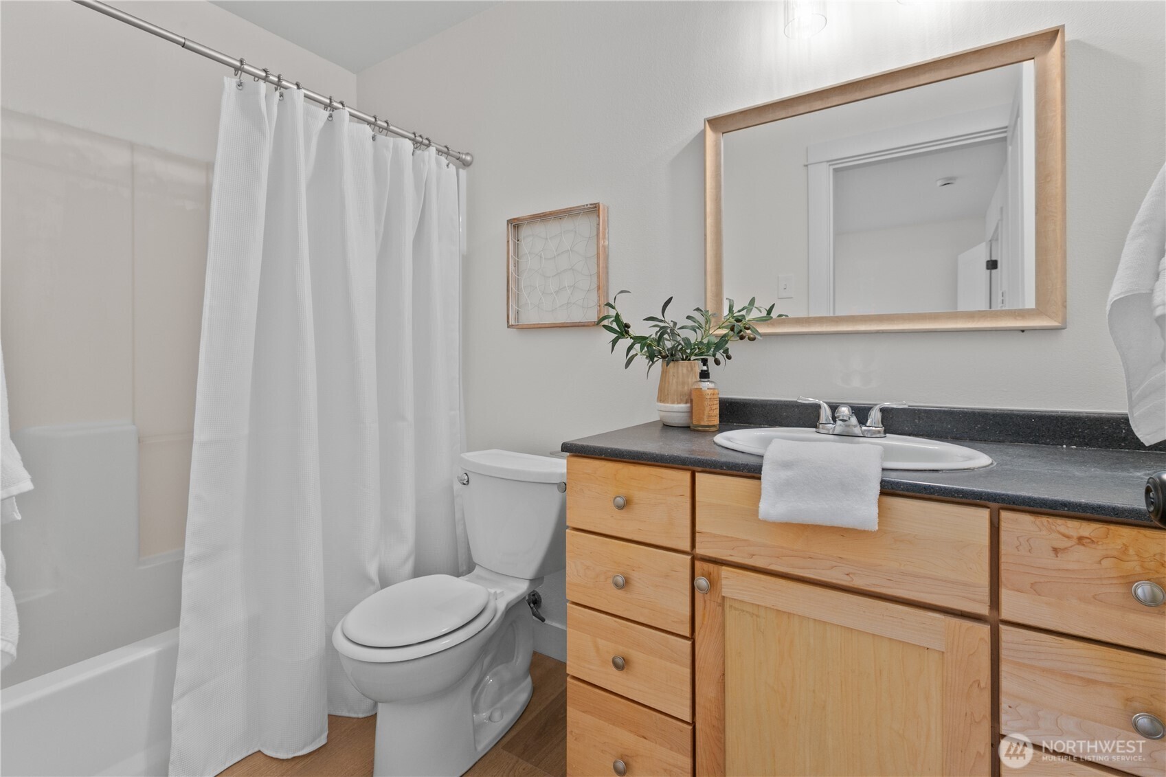693 Shultz Drive Bellingham, WA 98226 - Photo 25 of 34 a bathroom with a sink vanity mirror and toilet