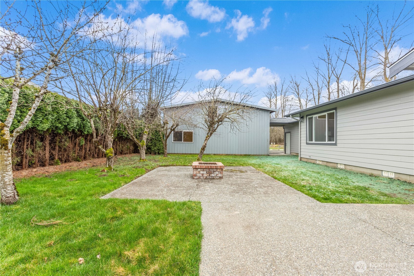 693 Shultz Drive Bellingham, WA 98226 - Photo 29 of 34 a backyard of a house with table and chairs