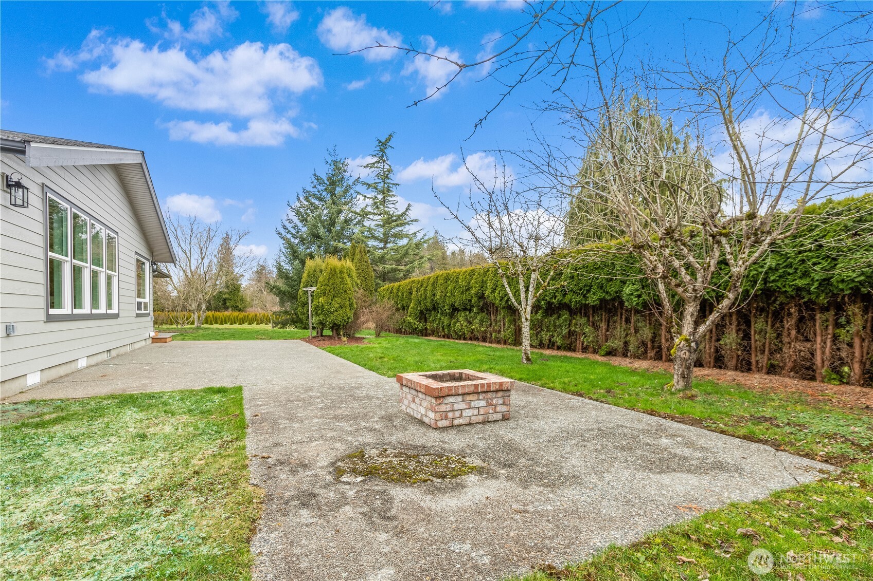 693 Shultz Drive Bellingham, WA 98226 - Photo 30 of 34 a view of a house with a yard and tree s