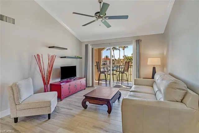 a living room with furniture fireplace and a flat screen tv
