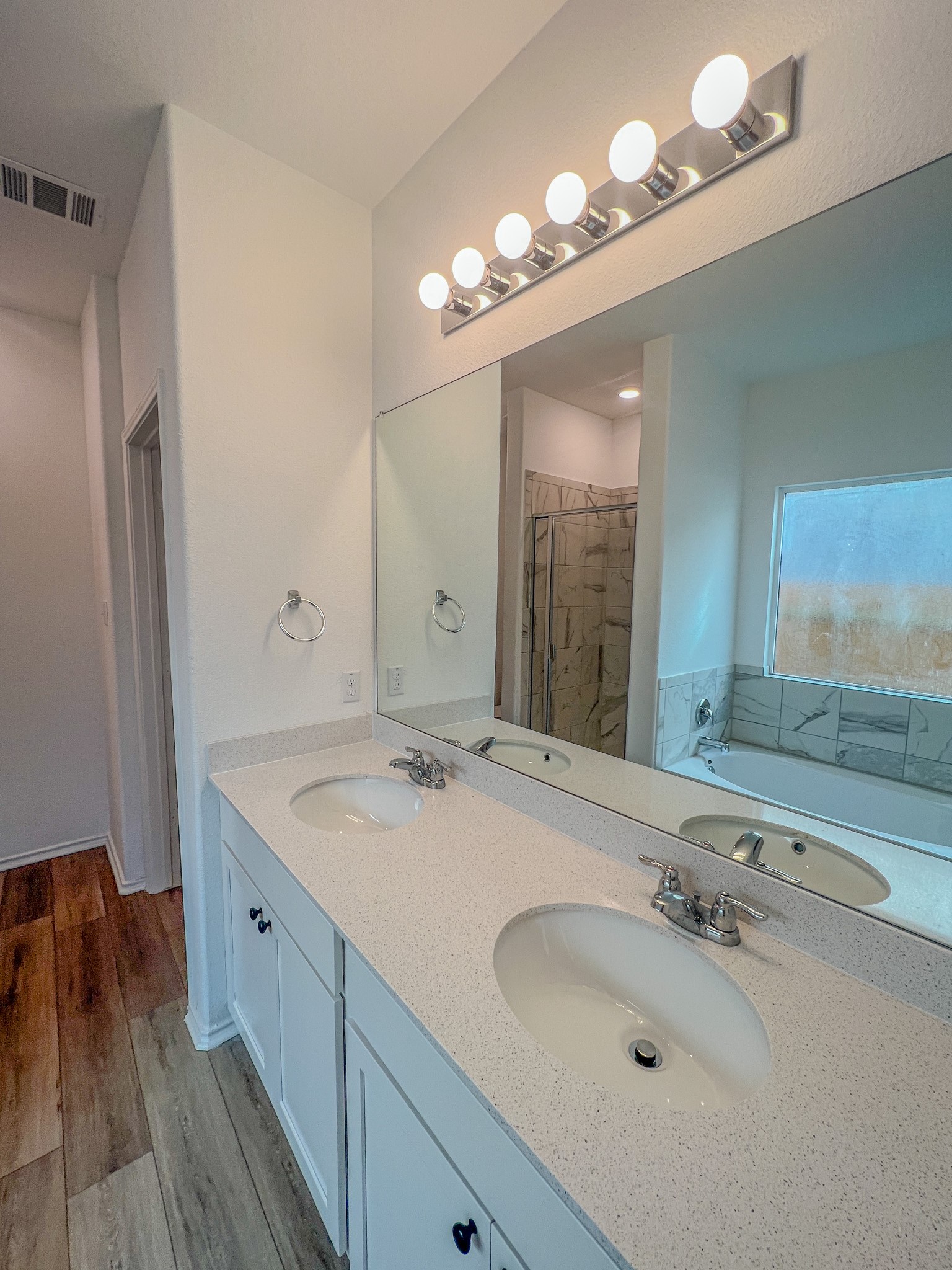 438 Perfect World Loop Jarrell, TX 76537 - Photo 10 of 35 a bathroom with a sink and a mirror