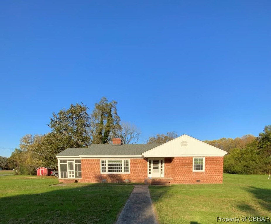 14 Light Street Heathsville, VA 22473 - Photo 1 of 18 View of front of home featuring a front yard and an outdoor structure