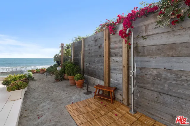 a outdoor space with lots of potted plants