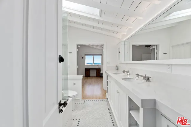 a bathroom with a sink and mirror