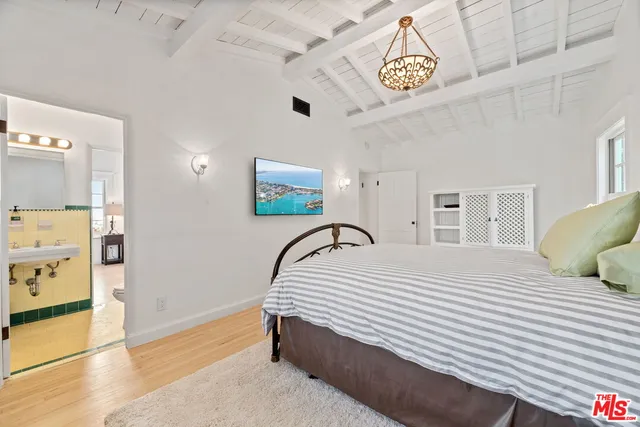 a bedroom with a bed and a cabinets