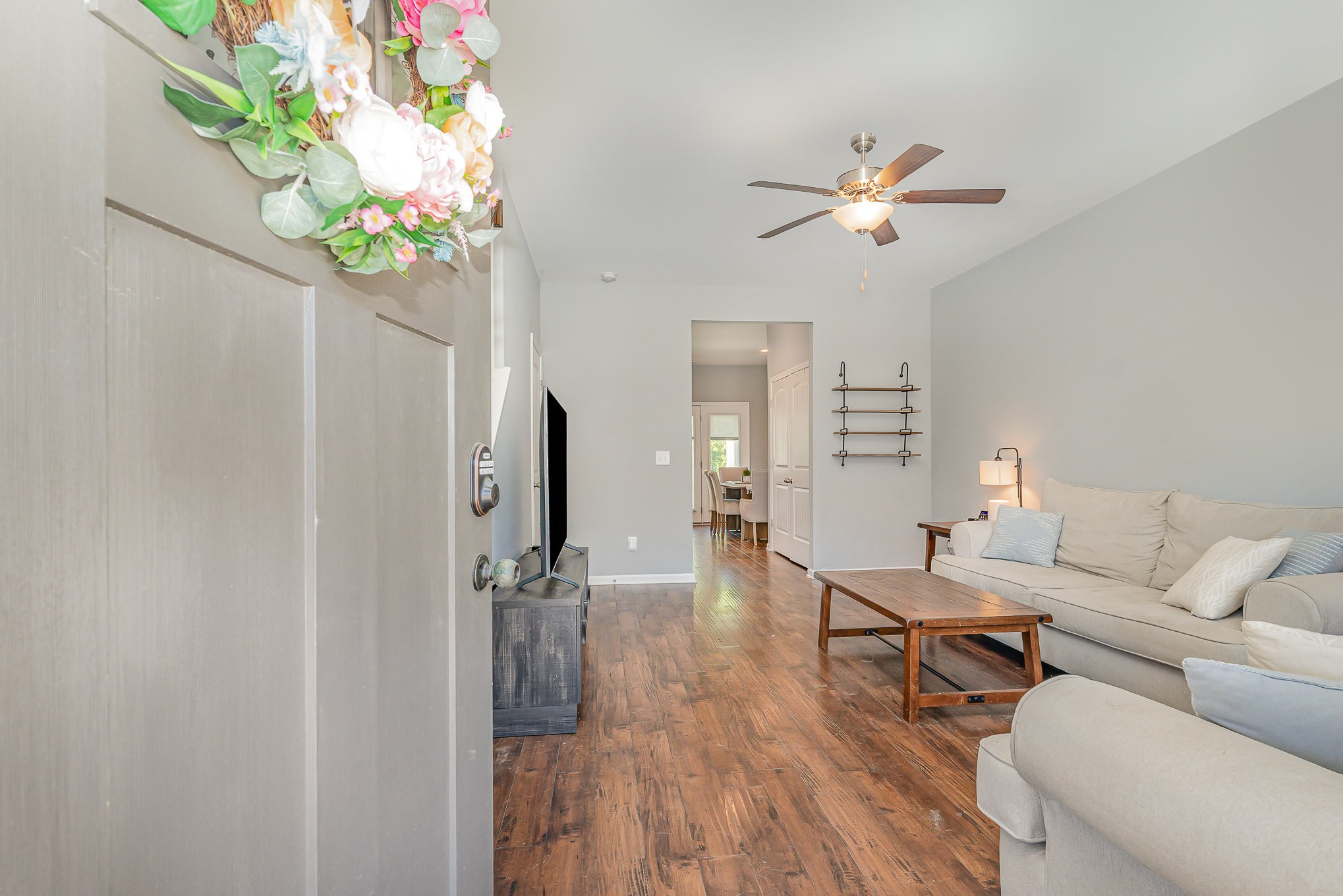 409 Bell Forge White Bluff, TN 37187 - Photo 2 of 17 a living room with furniture and a chandelier