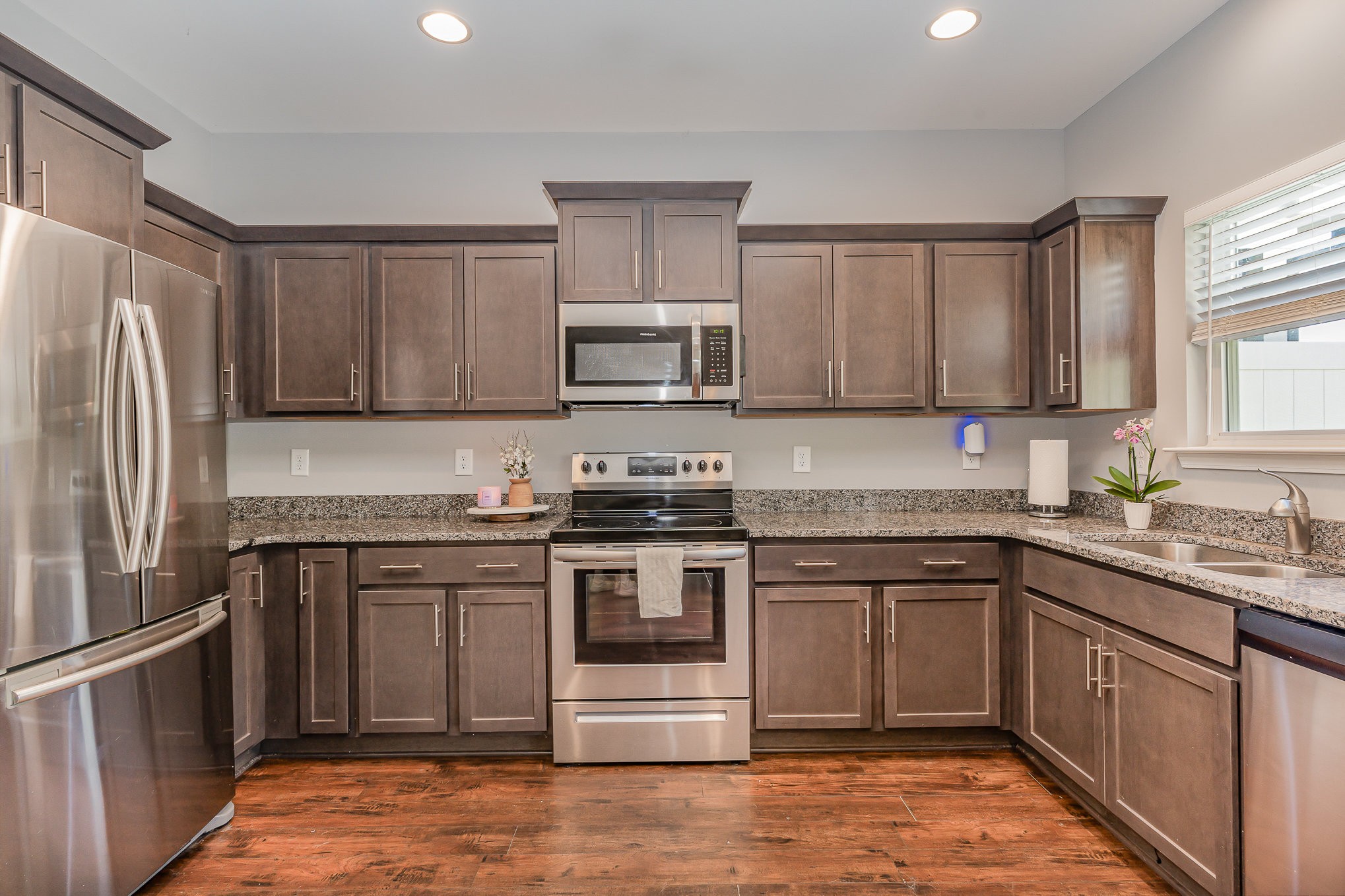 409 Bell Forge White Bluff, TN 37187 - Photo 6 of 17 a kitchen with stainless steel appliances granite countertop a stove top oven a sink and dishwasher
