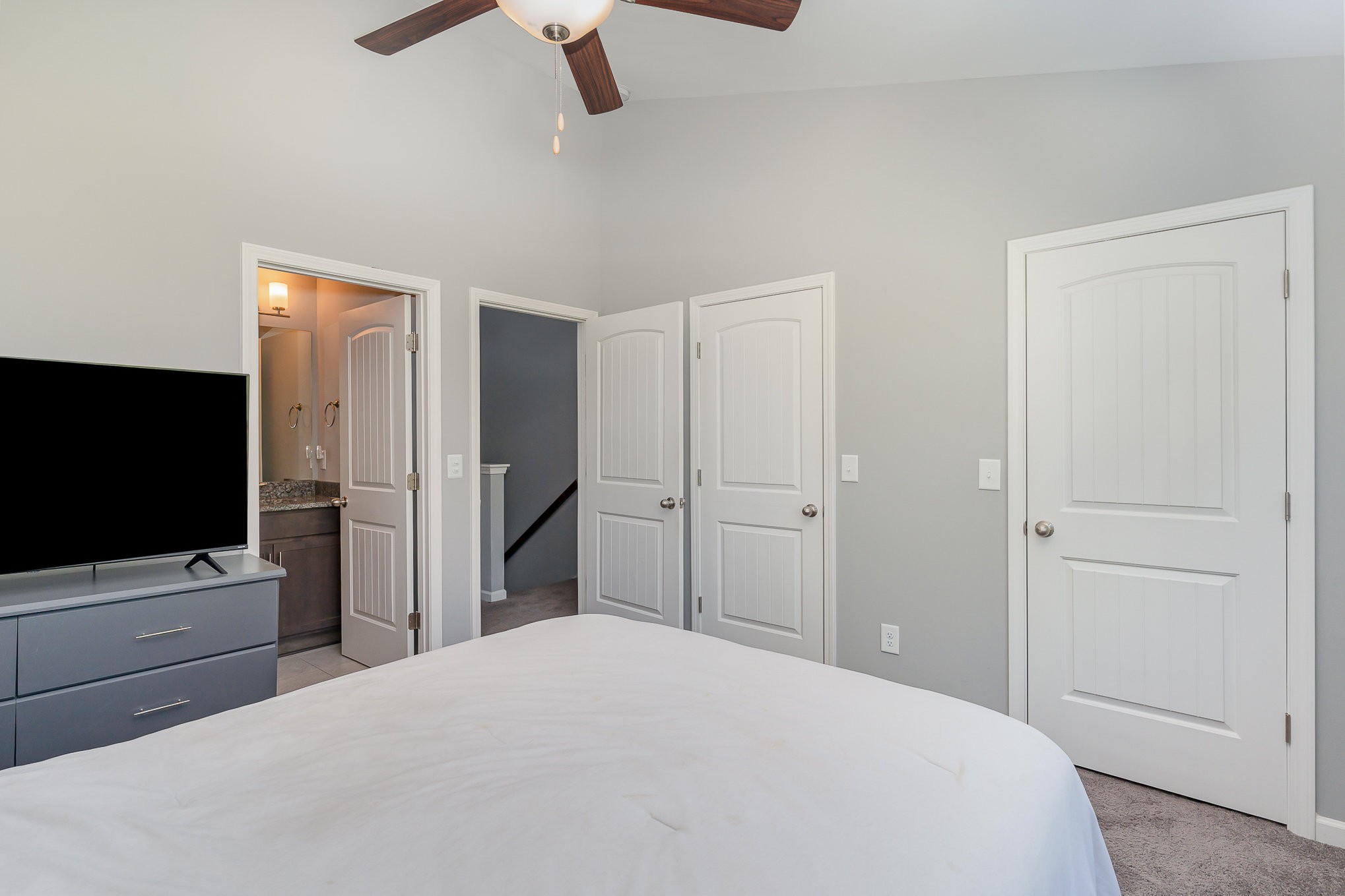 409 Bell Forge White Bluff, TN 37187 - Photo 7 of 17 a bedroom with a bed and a flat tv screen on wall