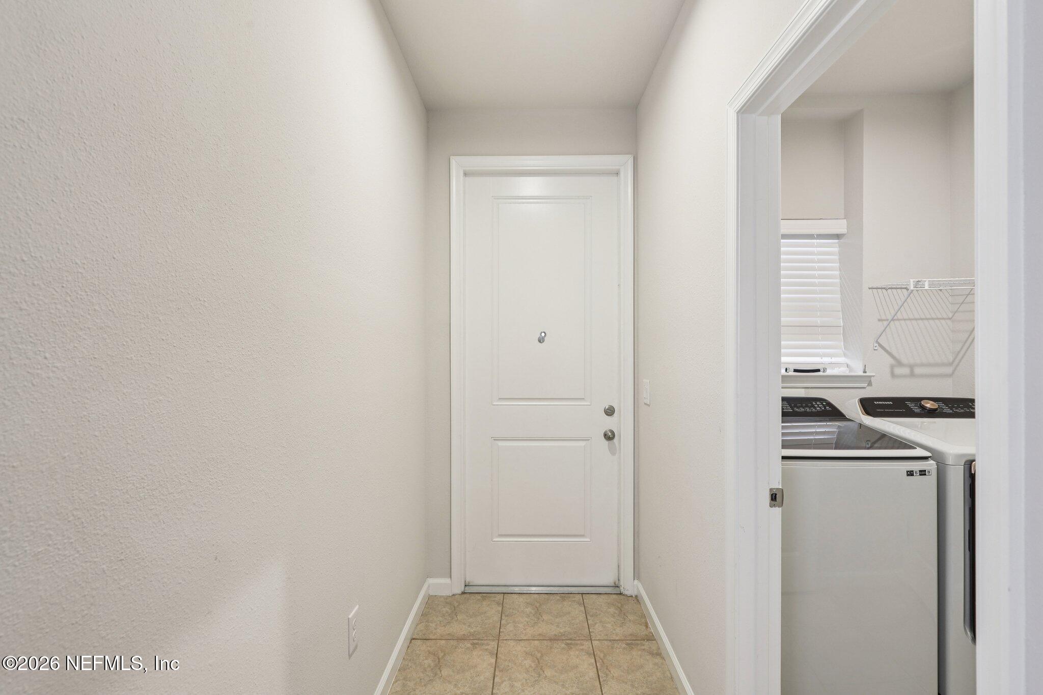 11325 Streamsong Drive Jacksonville, FL 32221 - Photo 15 of 30 a room that has a bed in it