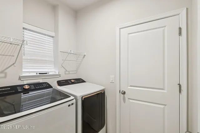 a bathroom with a sink and shower