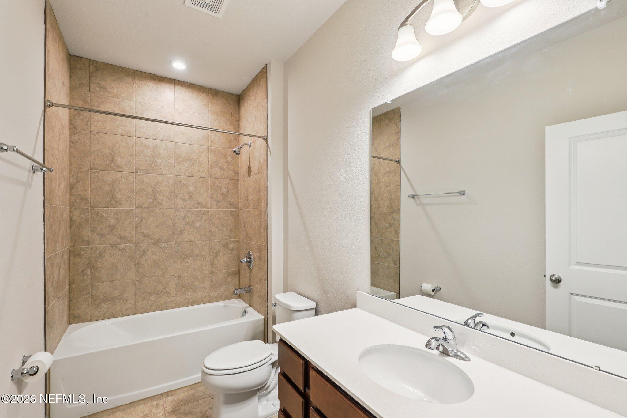 11325 Streamsong Drive Jacksonville, FL 32221 - Photo 24 of 30 a bathroom with a sink toilet tub and shower