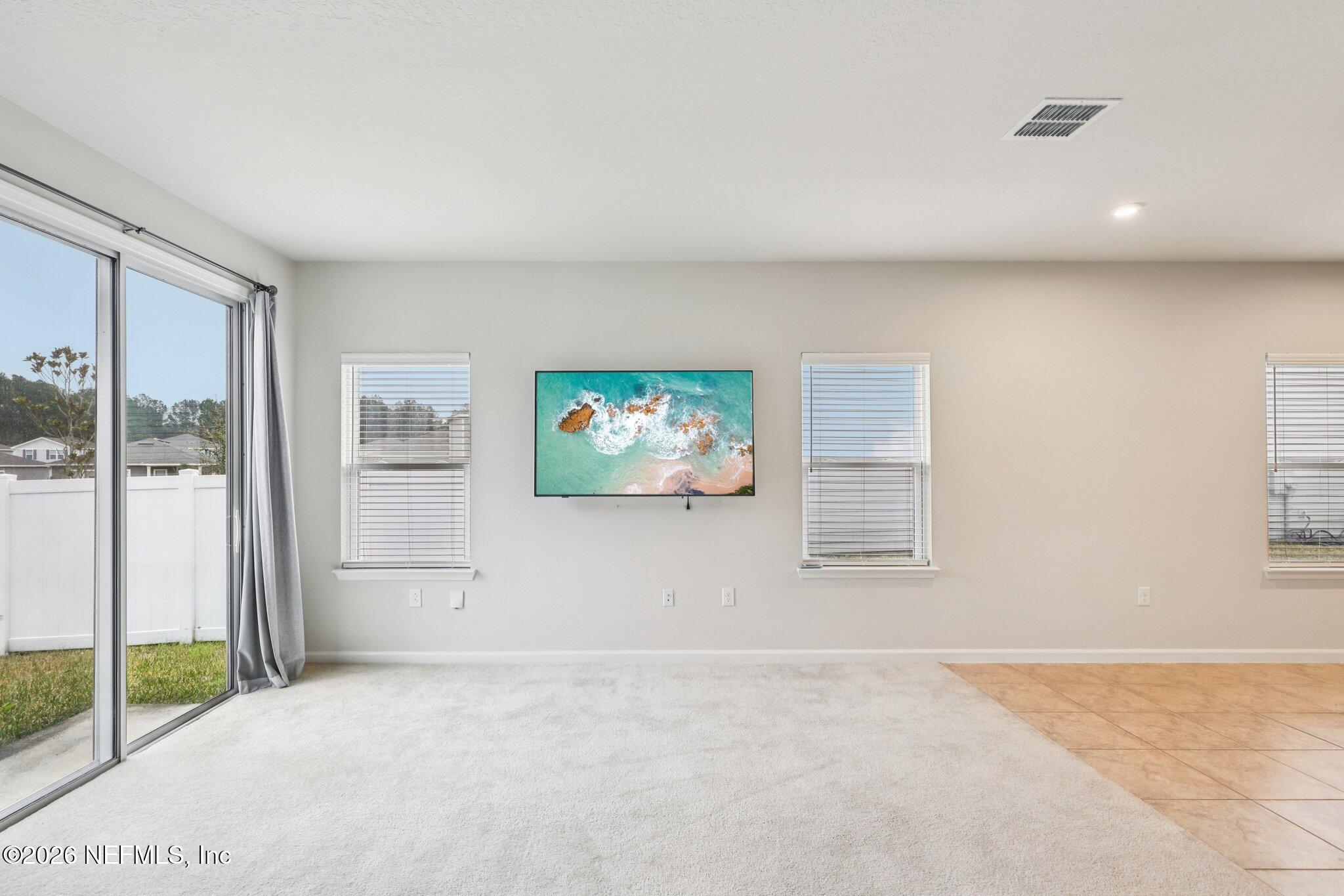 11325 Streamsong Drive Jacksonville, FL 32221 - Photo 9 of 30 an empty room with windows