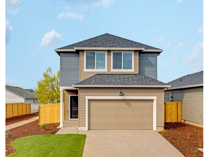 2774 U Street Springfield, OR 97477 - Photo 1 of 20 a front view of a house with a yard and garage