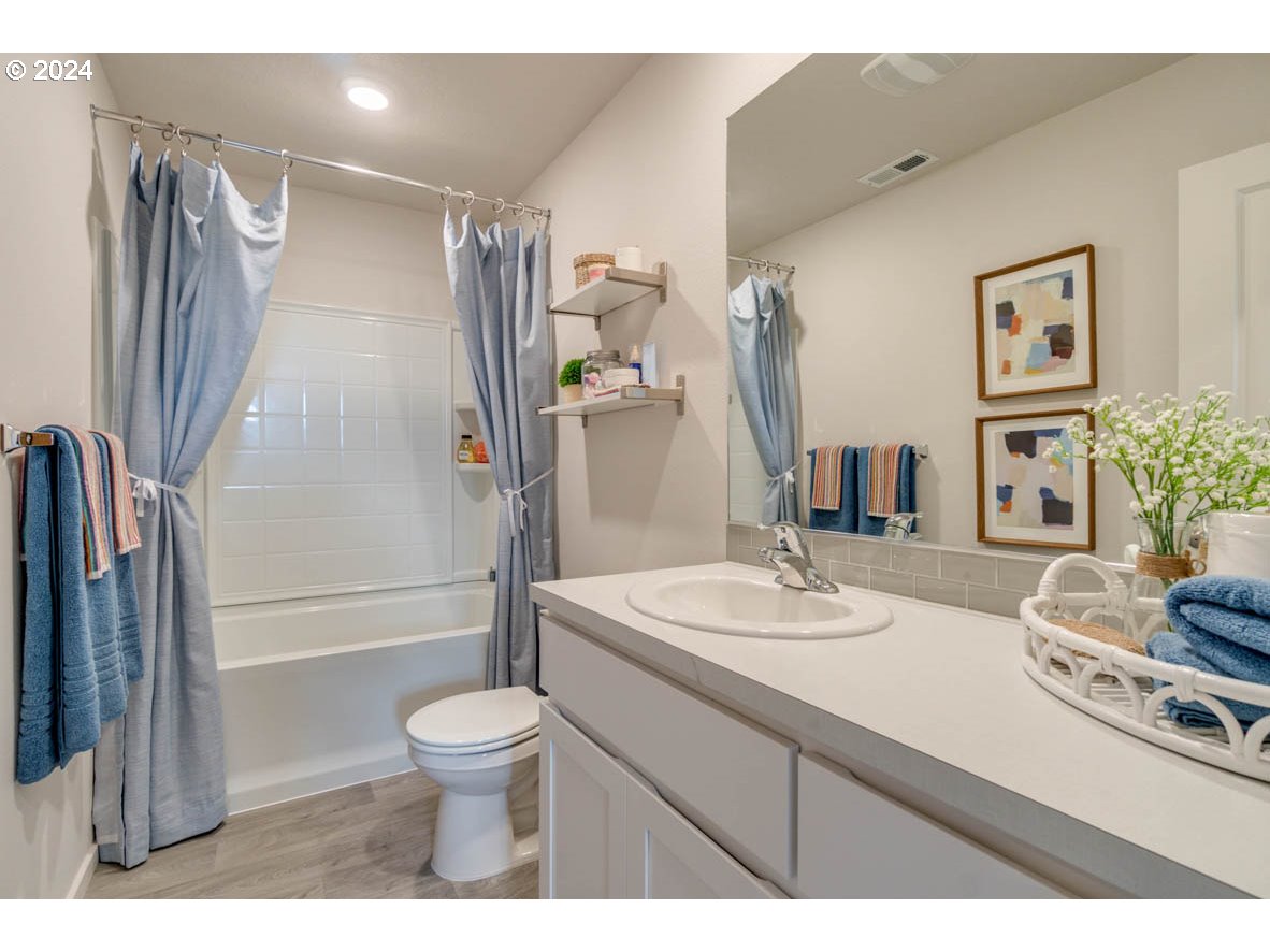 2774 U Street Springfield, OR 97477 - Photo 16 of 20 a bathroom with a sink a toilet and shower