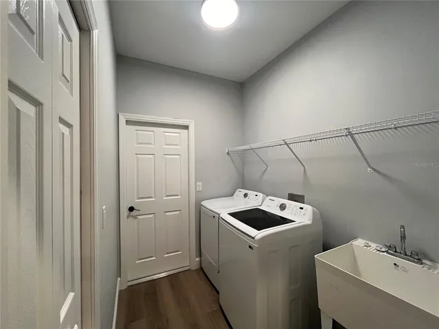 a utility room with dryer and washer