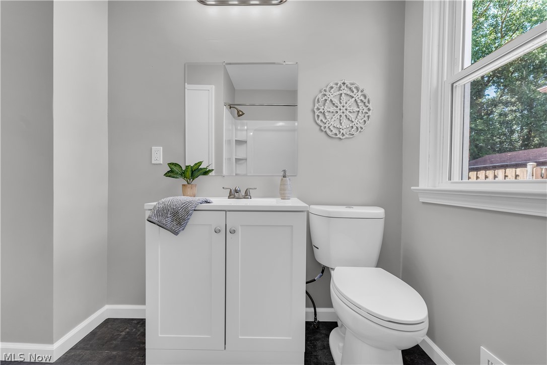 4322 Roadoan Road Brooklyn, OH 44144 - Photo 23 of 27 Bathroom with vanity, toilet, and tile patterned floors