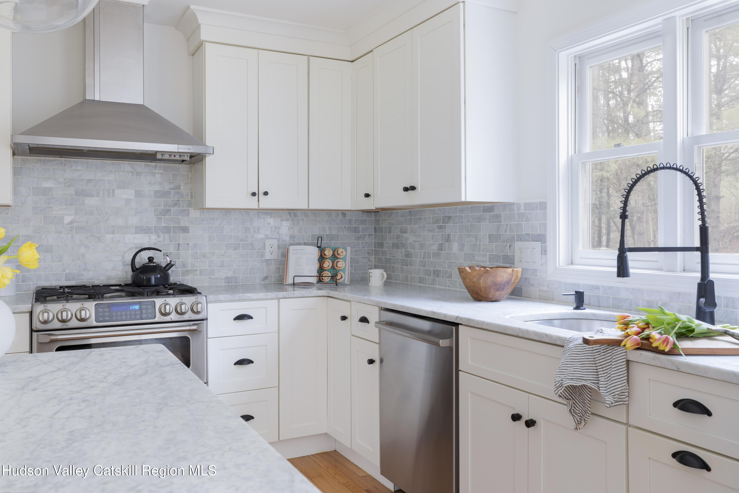 79 Stillwater Road Stone Ridge, NY 12484 - Photo 11 of 29 a kitchen with stainless steel appliances granite countertop a sink stove and cabinets