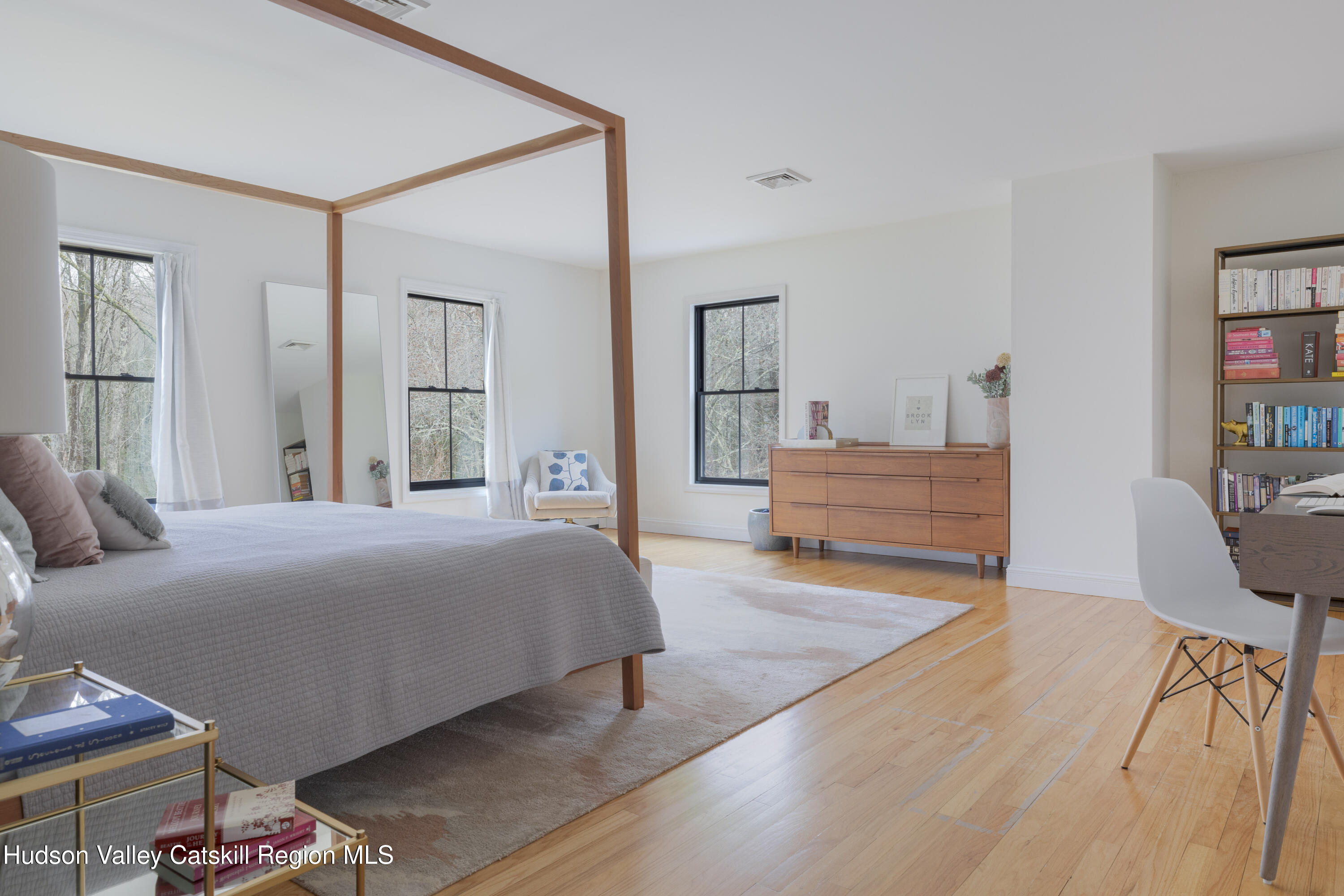 79 Stillwater Road Stone Ridge, NY 12484 - Photo 15 of 29 a bedroom with a bed and wooden floor