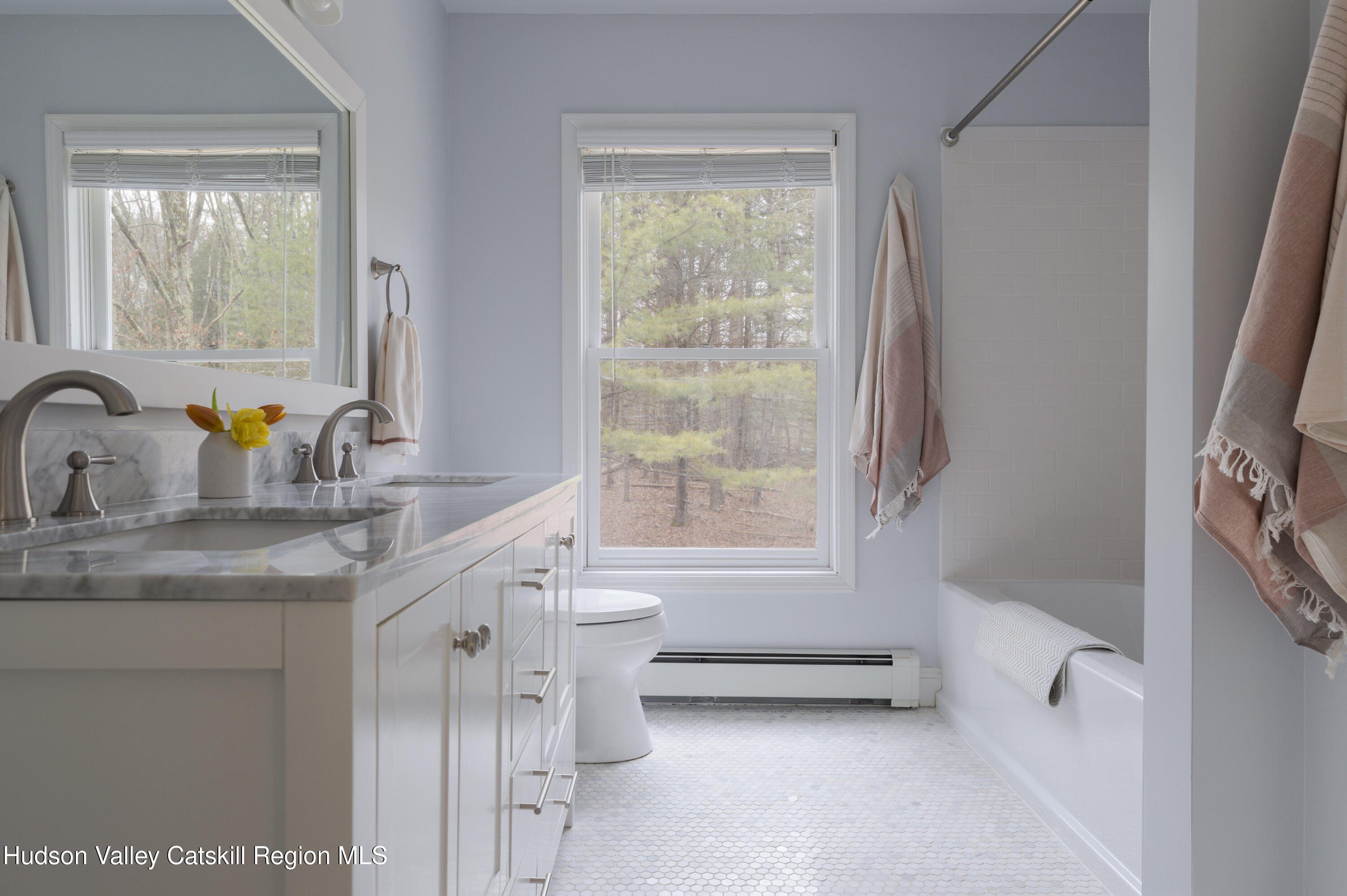 79 Stillwater Road Stone Ridge, NY 12484 - Photo 21 of 29 a bathroom with a granite countertop sink mirror and a bathtub