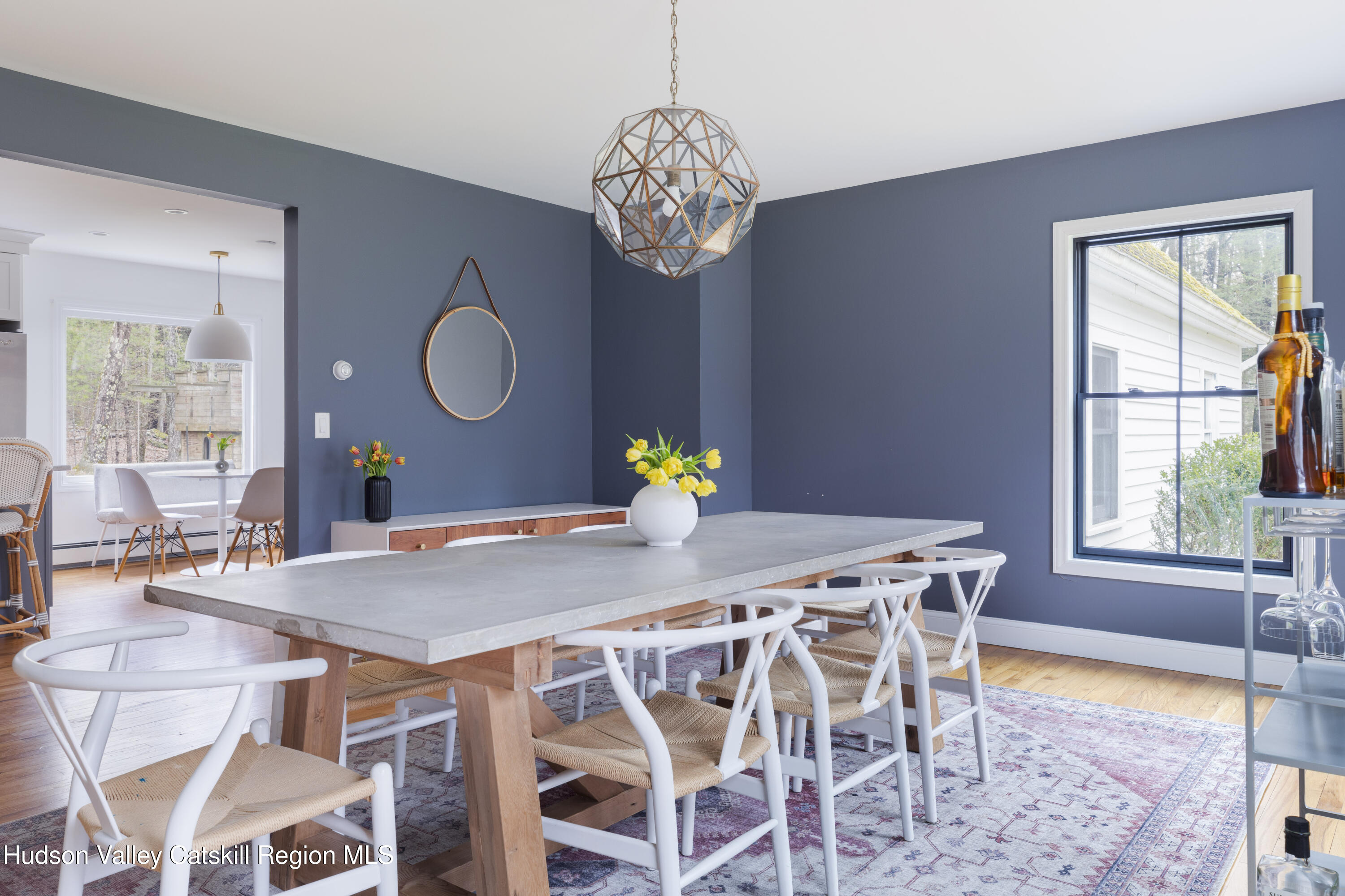 79 Stillwater Road Stone Ridge, NY 12484 - Photo 7 of 29 a view of a dining room with furniture wooden floor and chandelier