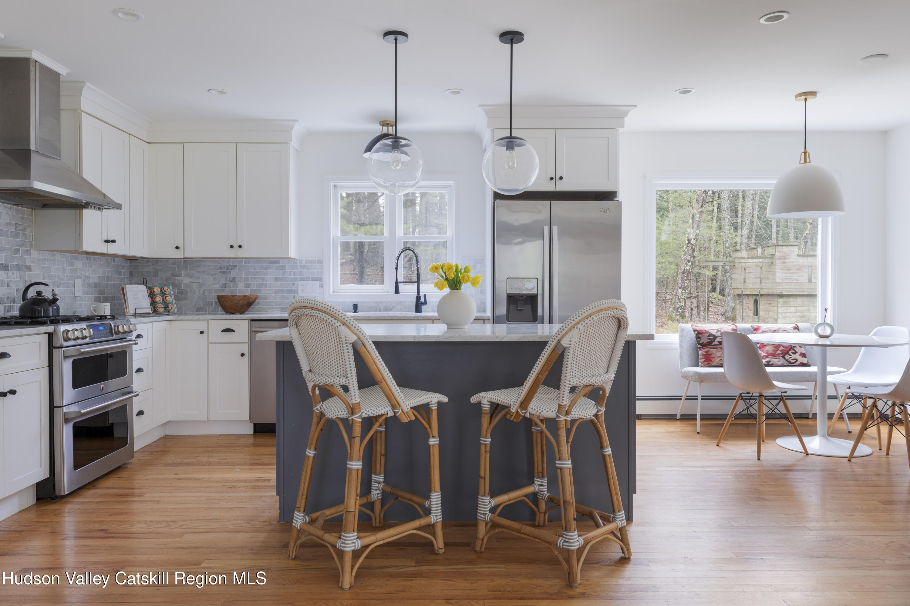 79 Stillwater Road Stone Ridge, NY 12484 - Photo 9 of 29 a view of kitchen with dining table chairs and wooden floor