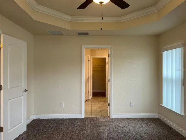 an empty room with a empty space and windows