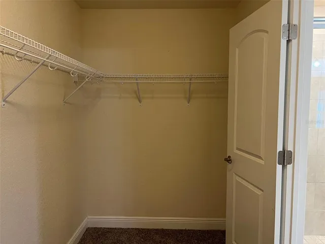 a bathroom with a granite countertop toilet sink and shower