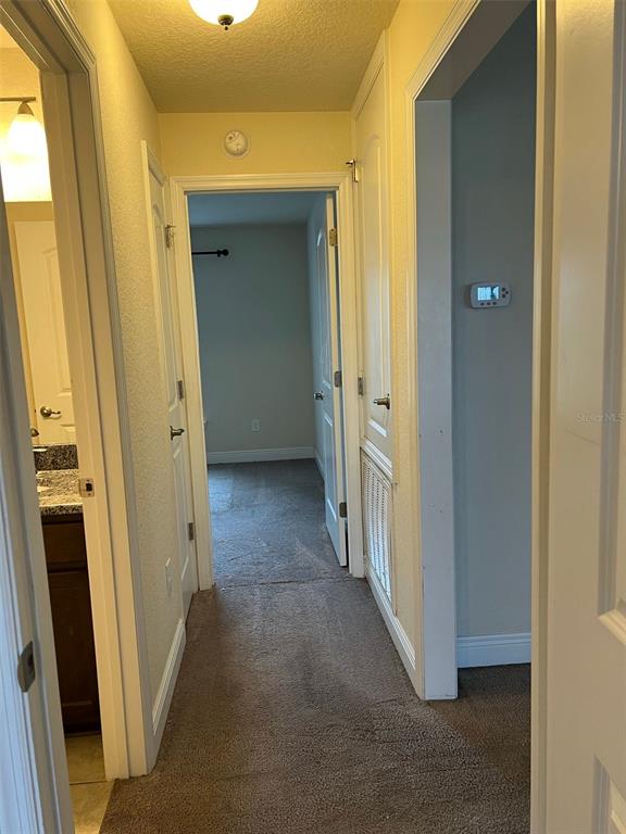 9883 Southwest 55th Ave Road Ocala, FL 34476 - Photo 18 of 30 a view of a hallway with a wooden door