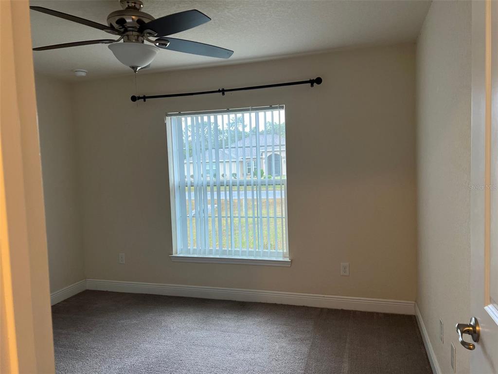 9883 Southwest 55th Ave Road Ocala, FL 34476 - Photo 20 of 30 an empty room with a window