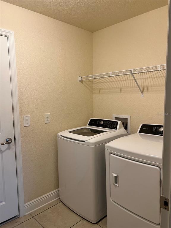 9883 Southwest 55th Ave Road Ocala, FL 34476 - Photo 27 of 30 a utility room with dryer and washer
