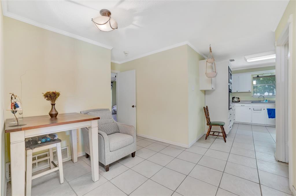 6021 Sycamore Creek Road Edgecliff Village, TX 76134 - Photo 23 of 37 a living room with furniture and a chandelier
