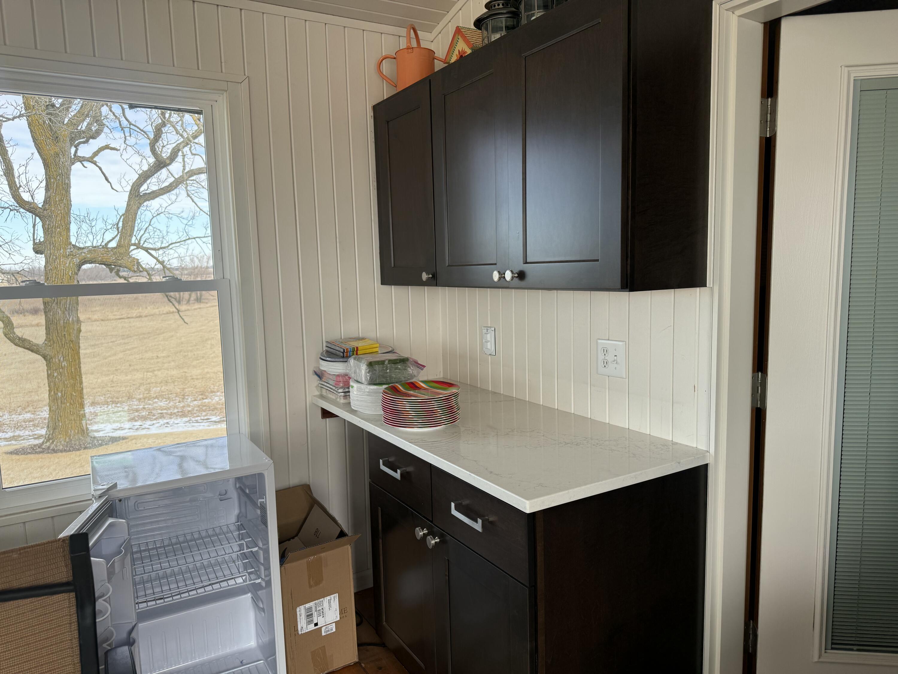N5748 Metovale Road Metomen, WI 53919 - Photo 16 of 34 Sunroom entertaining space serves a purpose year-round...snacks in warmer months and cooling/storing cookies amidst the holidays!